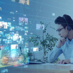 young man in glasses stares at computer screen on right as composite of many onscreen events occupies left half.